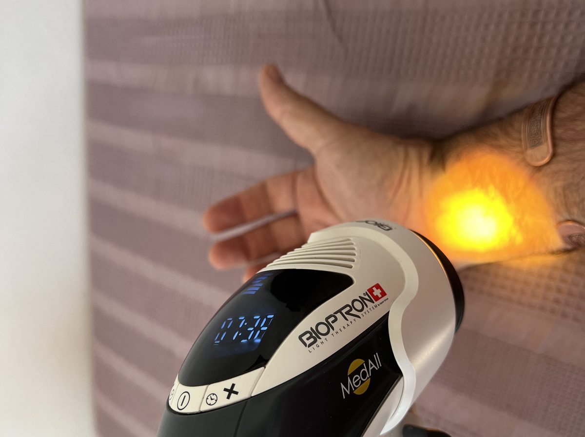 Bioptron polarised light therapy applied to the wrist